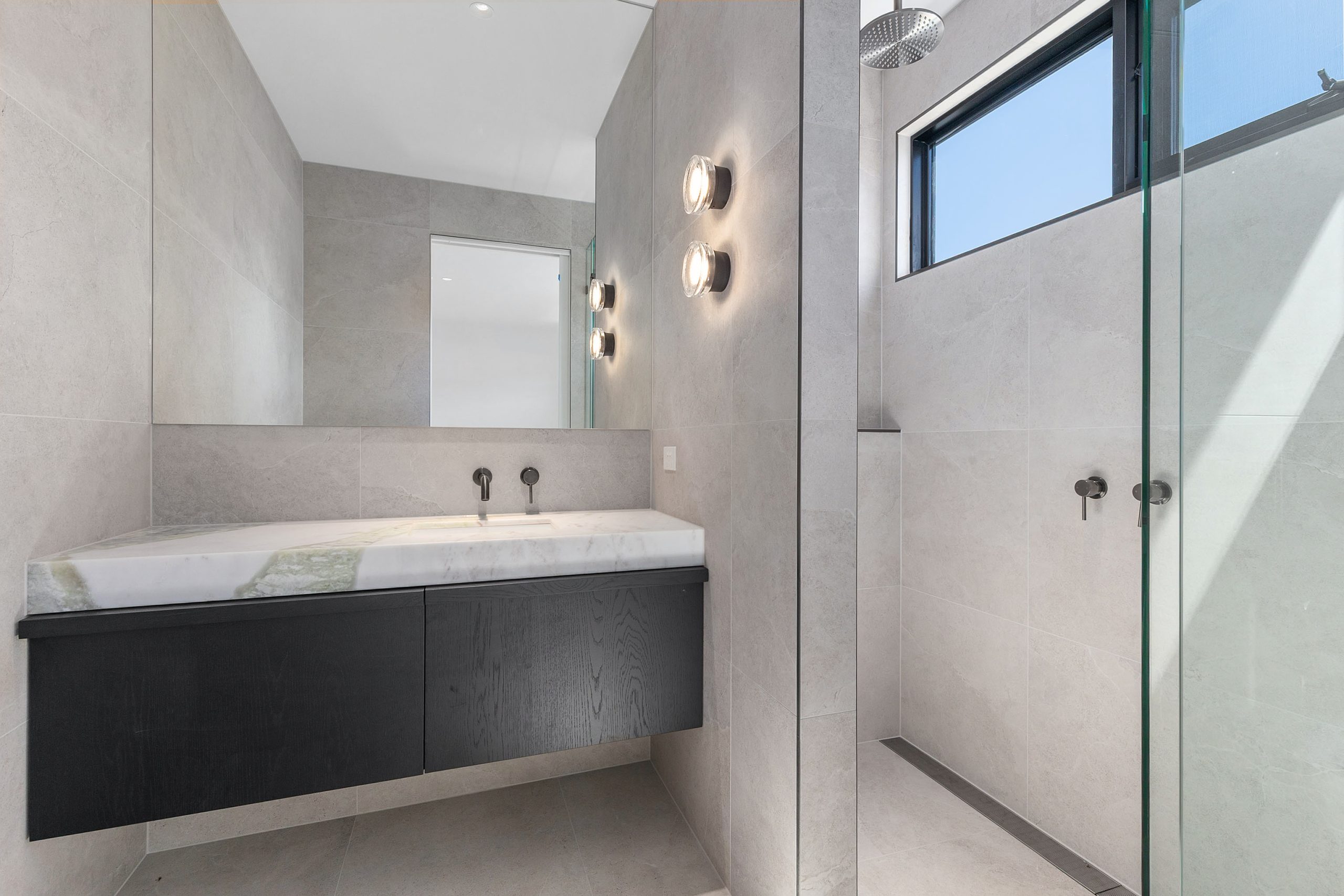 oyster green marble stone installed in bathroom vanity